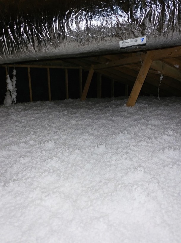 Even blown-in attic insulation after installation